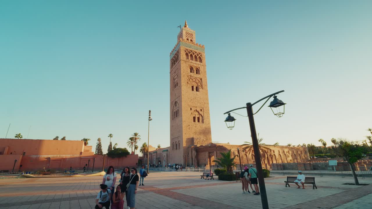 Panoramic shot of the beautiful Koutoubia Mosque in Marrakesh, Morocco at golden hour time. Moroccan heritage. Religious site. Medina.