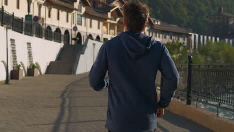 man running through a european town