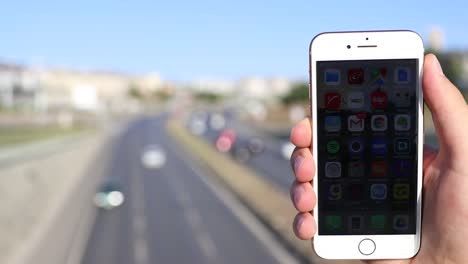 Man-Pointing-At-Mobile-Phone-Screen