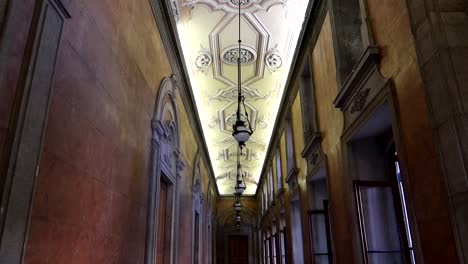 tilt down shot of hallway inside of palacio da bolsa in porto