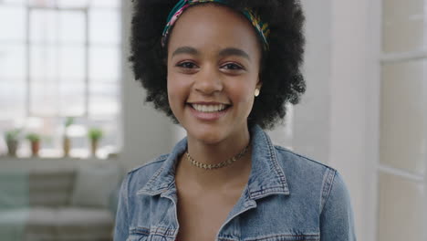 beautiful young african american woman portrait of cute trendy black girl smiling looking at camera vulnerable shy female wearing denim jacket
