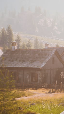 a small farmhouse in a mountainous landscape