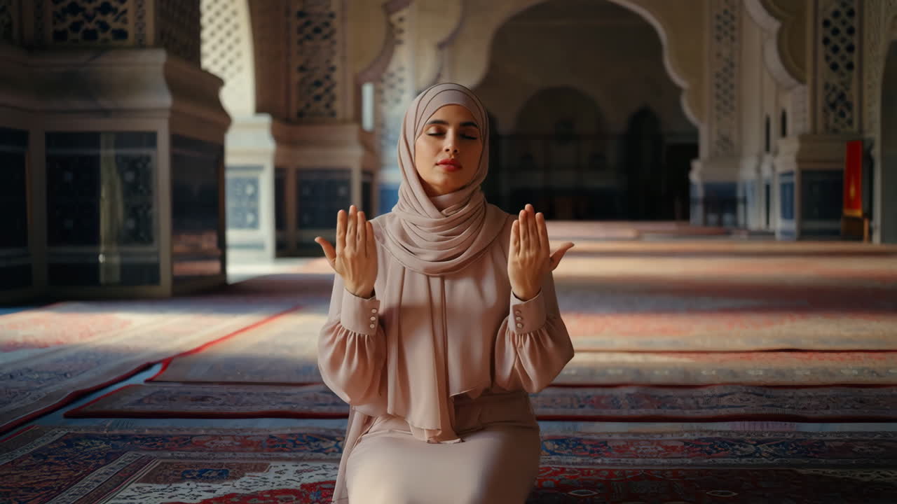 Muslim Woman in Hijab Praying in a Mosque
