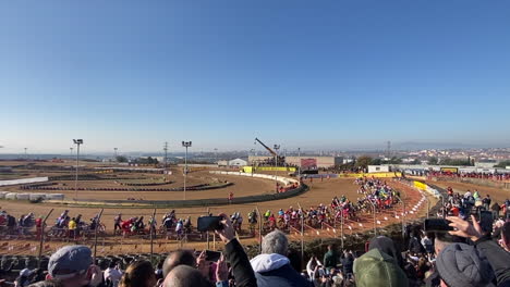 motocross race start at stadium, crazy atmosphere