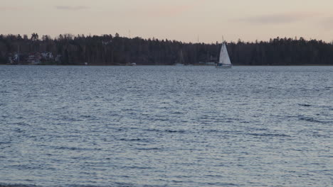 sail boat in swedish archipelago on the waves of the sea in slow motion