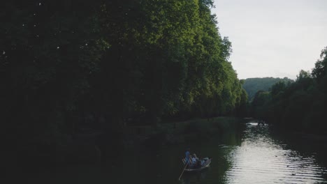 Ducks-Near-Boat-on-River-in-Tubingen,-Germany-in-4K-Downtown-Home-of-Europes-Oldest-University-At-Sunset