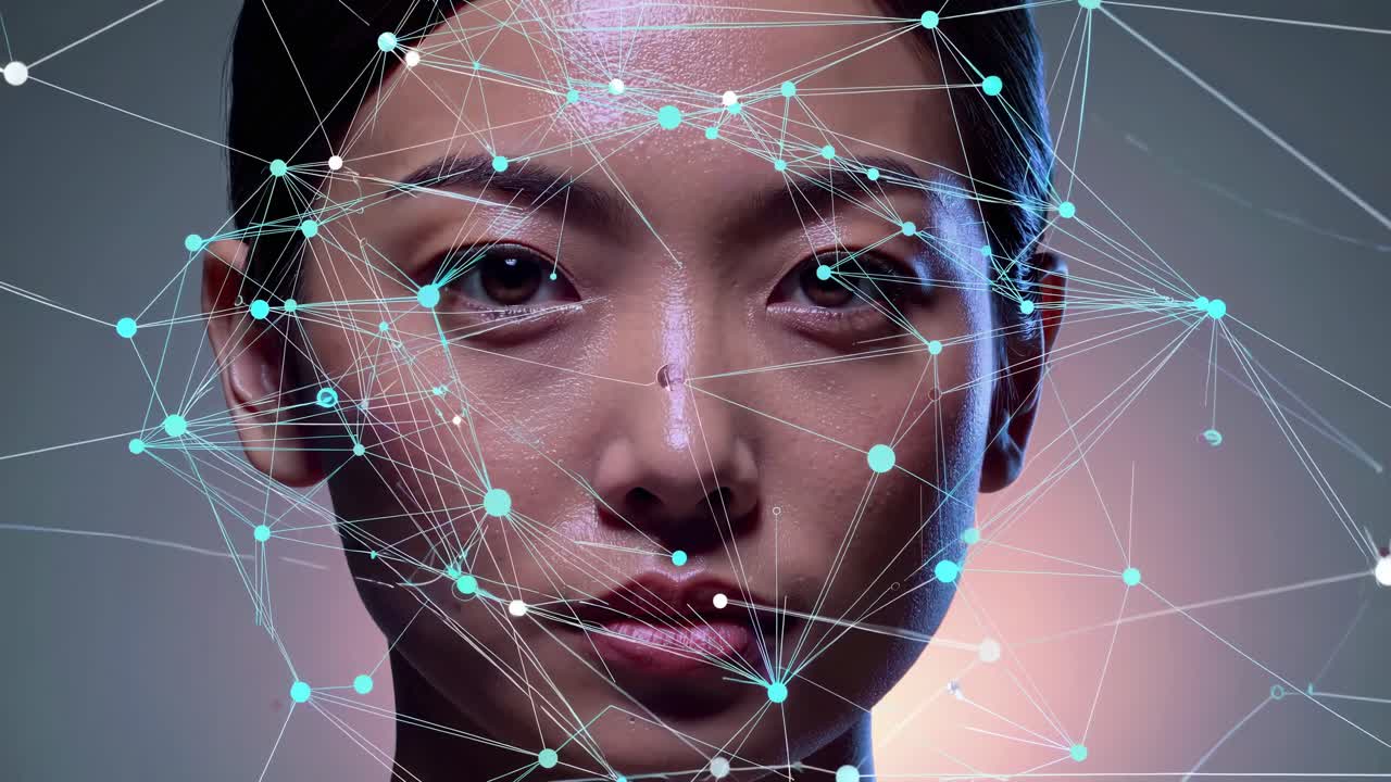 Close-up video of a woman's face with digital network overlay, illustrating technology