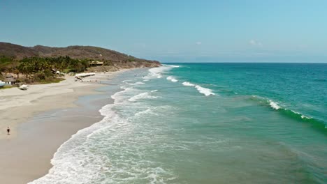 birds eye view flying over clear ocean waves at mexico seaside