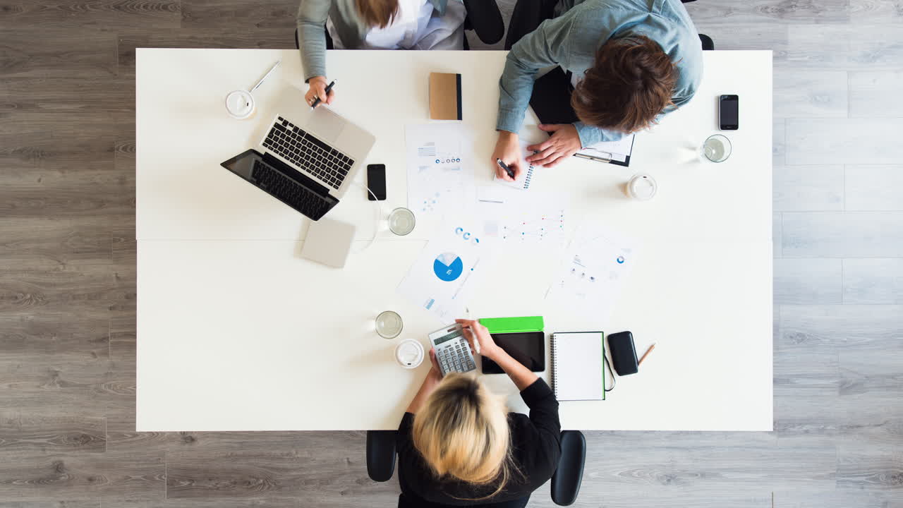 Diverse group of people aerial view timelapse creative business meeting planning thinking ahead startup company