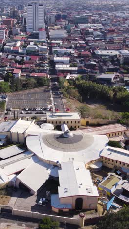 aerial view of the san jose costa rican center of science and culture, a children's museum, revealing its unique circular roof design. vertical video