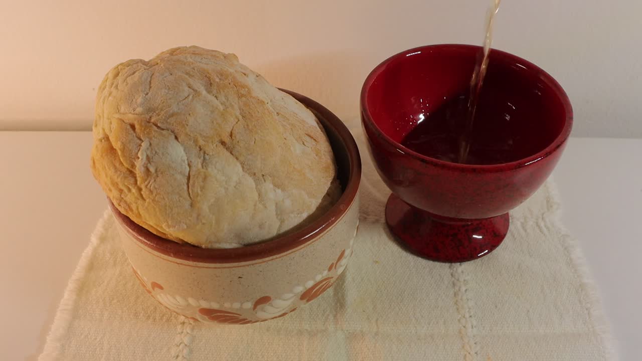 in the eucharist the love of jesus christ incarnate and transformed into bread and wine is presented from fraternity, community, love and hope. and the priest consecrates light