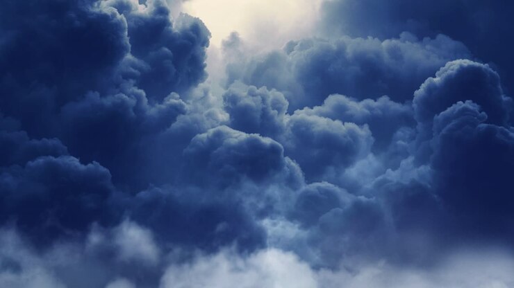 thick cumulus clouds in the sky with a thunderstorm