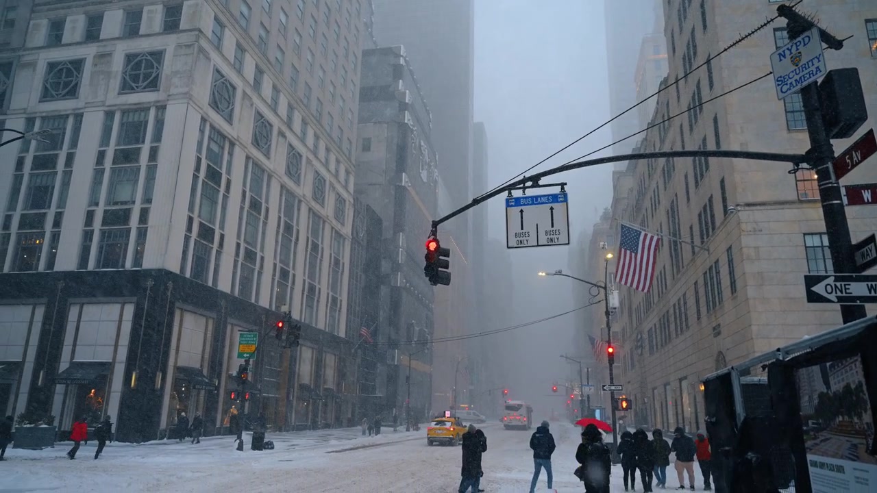 New York, USA, 9 January 2026: Intersection of 5th Ave and W 58th St in New York blizzard. Street signs at 5th Ave and W 58 St in New York City during a heavy winter snowstorm and blizzard.