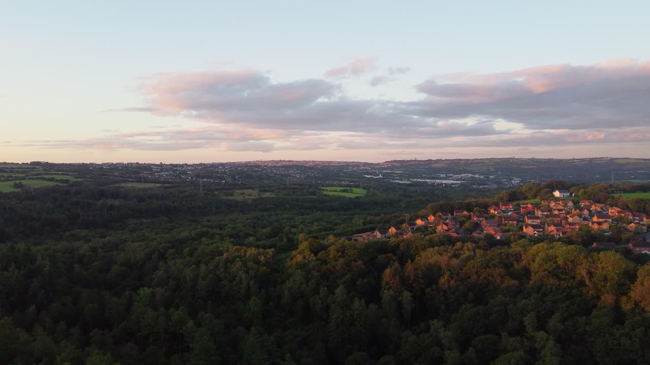 Morning Sunrise Light Over Forest Landscape with Houses on Hill Top