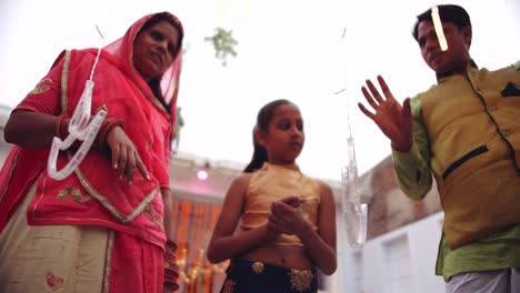 young parents with daughter celebrate decorate for diwali festival