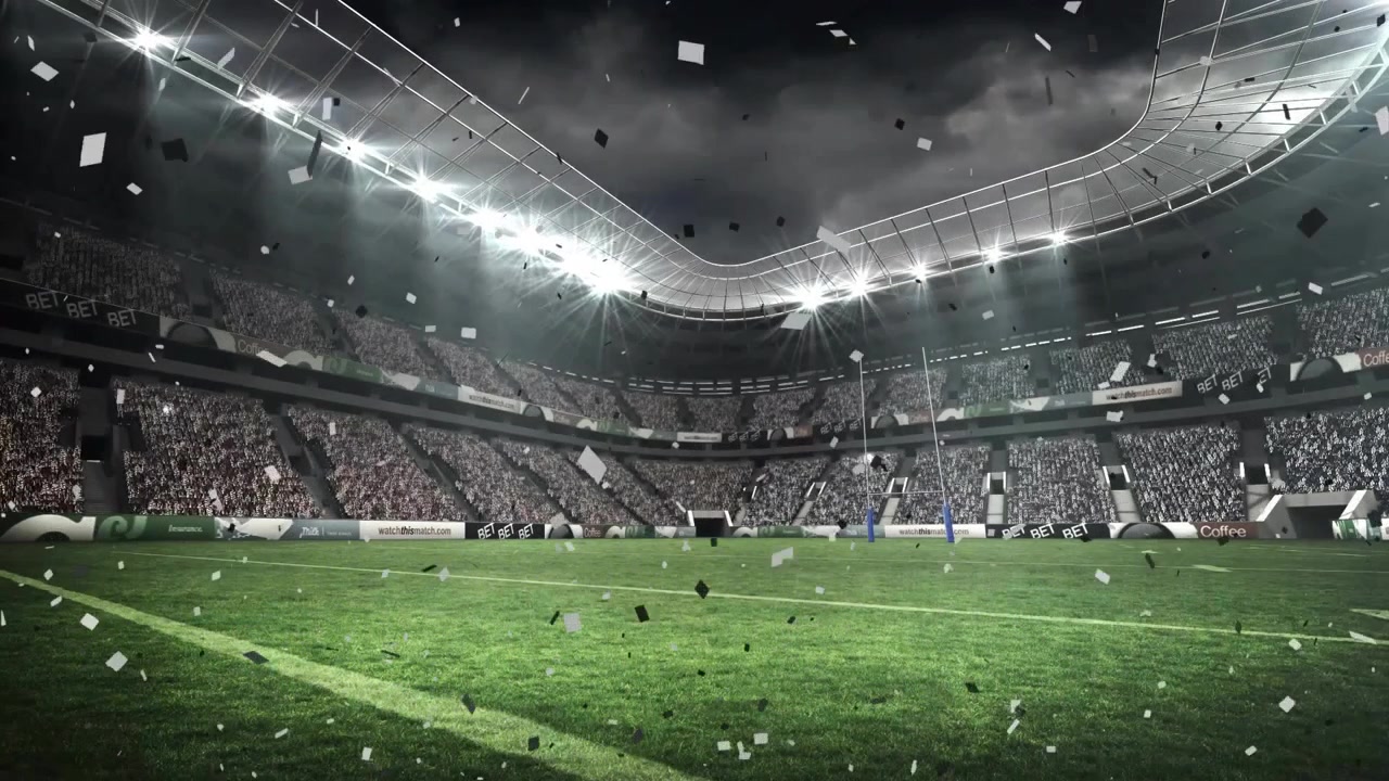 Riflettori che lanciano coriandoli sul campo dello stadio, fluttuando sotto i fasci di luce, celebrando la vittoria.