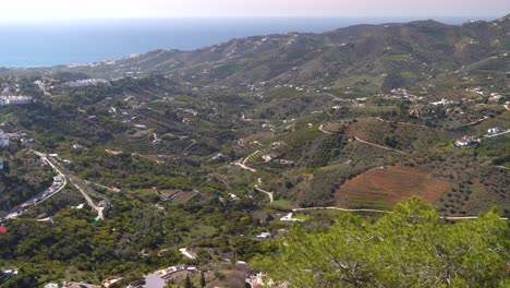 Beautiful-Mediterranean-landscape-with-many-green-hills-and-ocean-in-Andalusia,-Spain