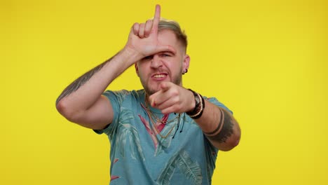 man making a loser sign and pointing