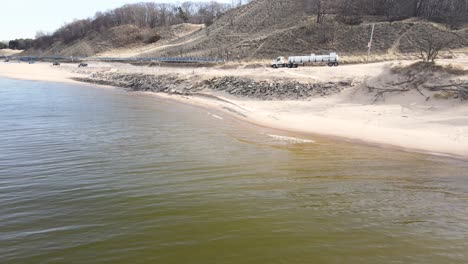 chemical truck driving down toward the beach