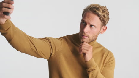 bearded man posing for selfie photo