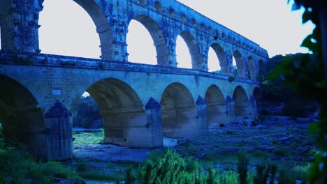 bridge of historic roman buildings in france in sunshine