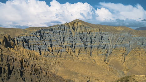 Dry-mountains-range-under-the-blue-cloudy-sky