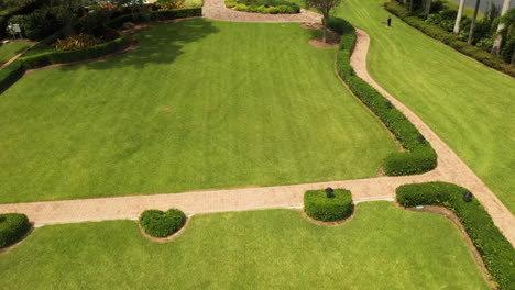 Aerial-Reveal-and-fly-over-public-Spanish-style-house-on-the-park