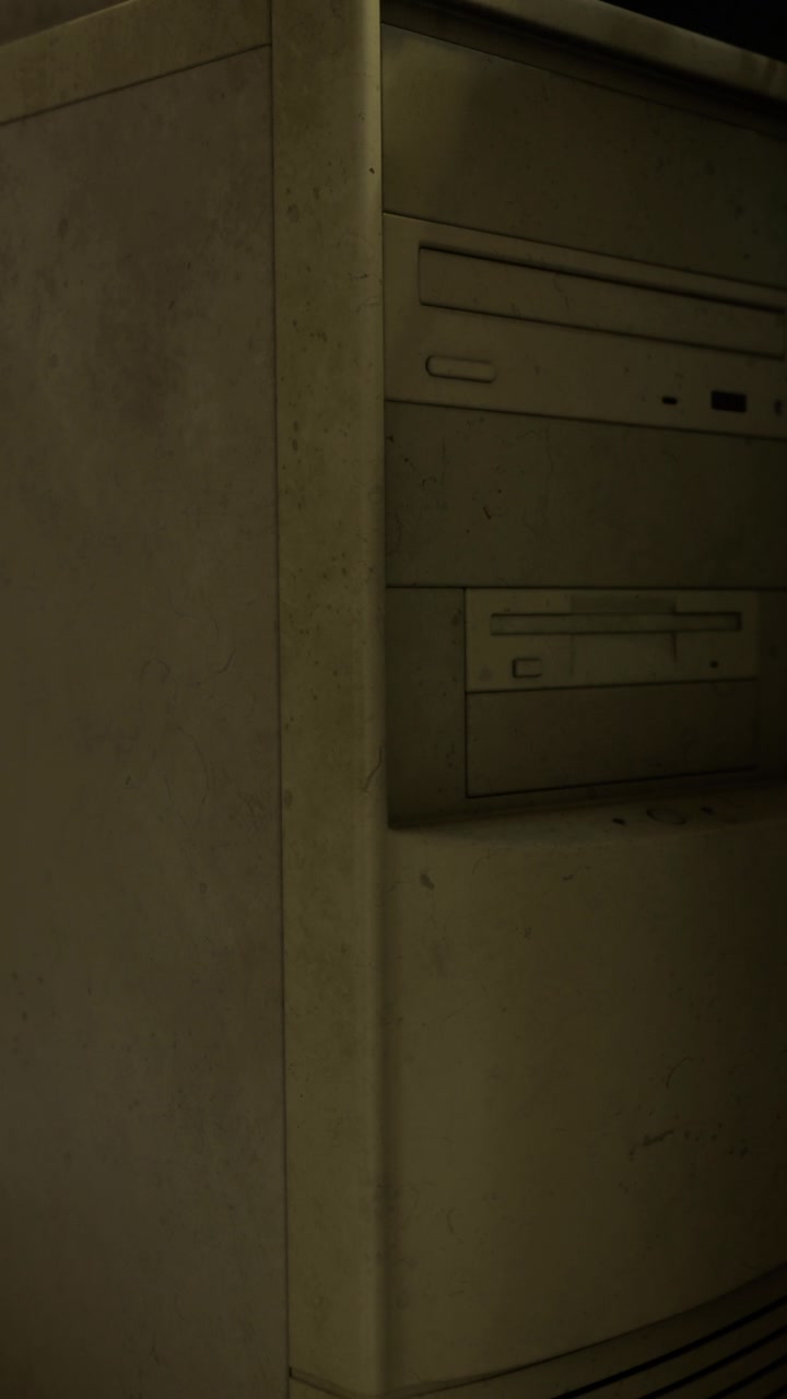 Old computer tower in a dark room showing signs of dust and wear