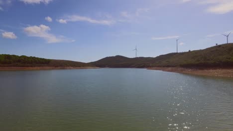 A-lake-near-Albufeira,-Portugal,-with-people-SUP-ing