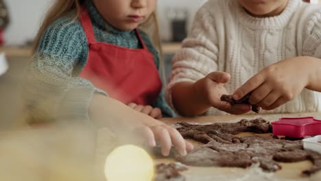 video of mother helping children with cookie baking