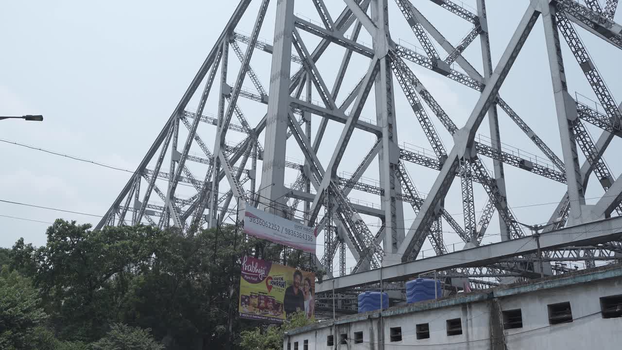 Close-up of the iconic Howrah Bridge steel structure in Kolkata, India