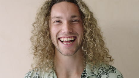 close-up-of-cool-looking-young-man-laughing-portrait-of-relaxed-student-happy