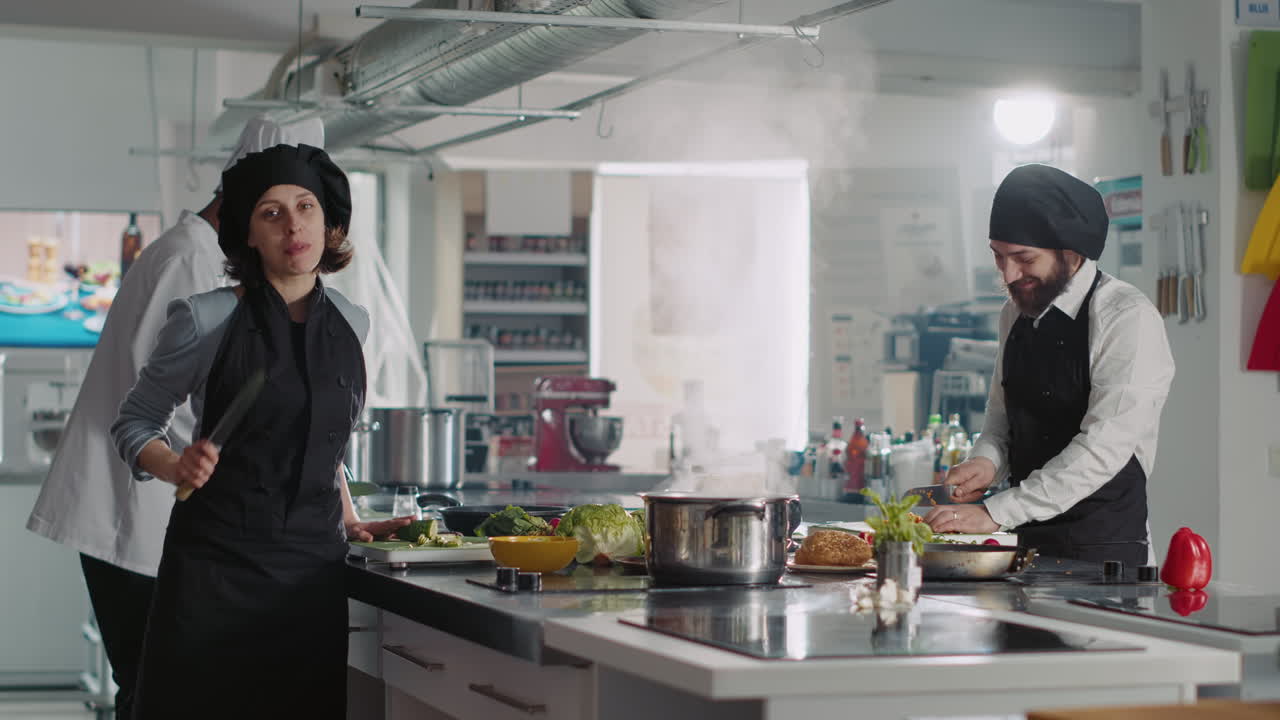 POV of woman and man recording professional cooking show