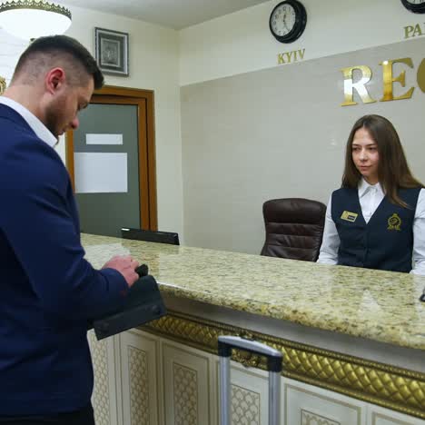 man registering in hotel