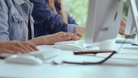 close up shot of businesswoman hand typing and working on computer on desk.