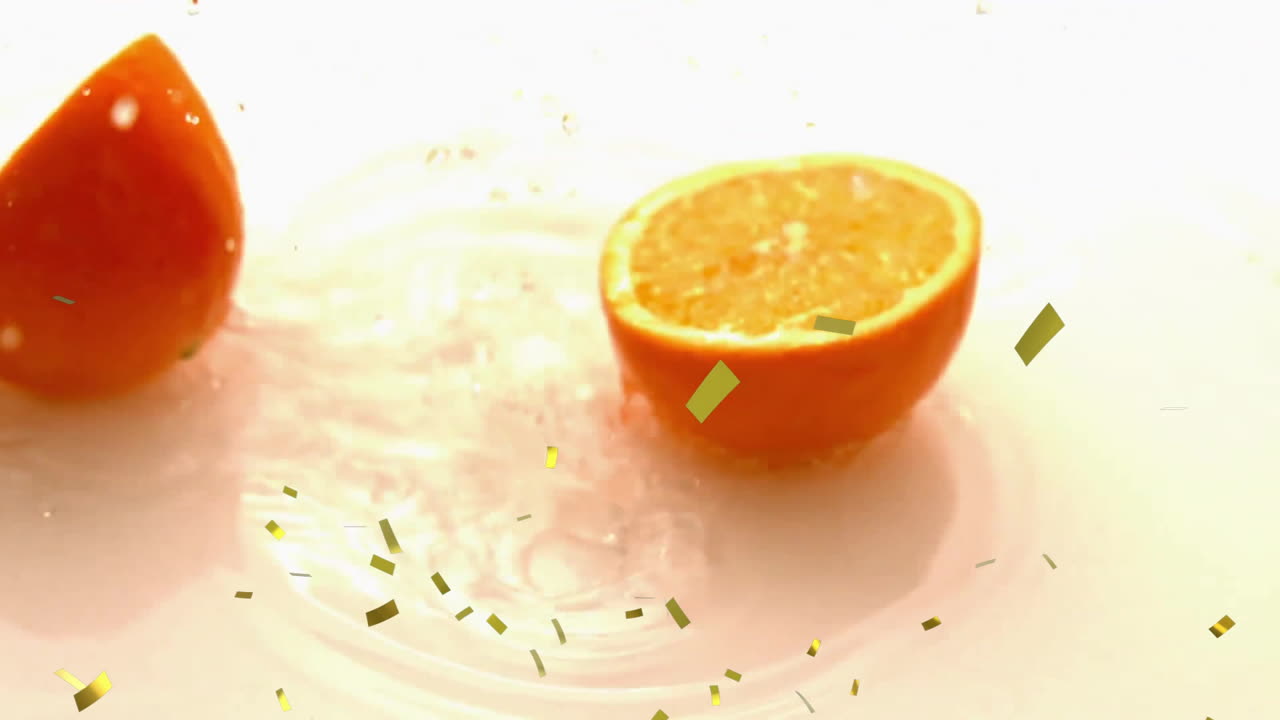 Animation of confetti falling over slices of orange