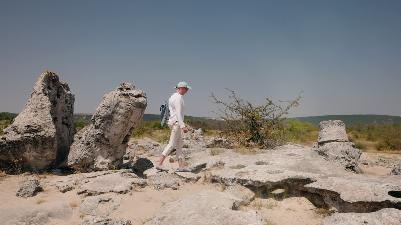 Woman exploring a stone forest