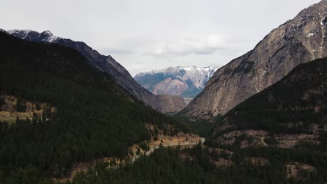 Aerial-view-of-Duffey-Lake-Road-in-a-mountainous-area-of-British-Columbia,-Canada