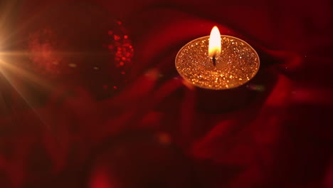 animation of christmas red bauble decoration and candle