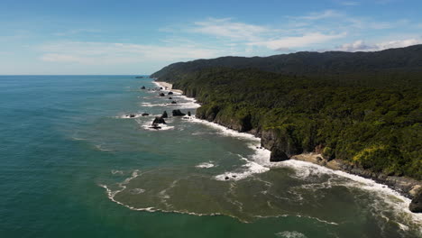 aerial flying forward on knights point lookout, new zealand