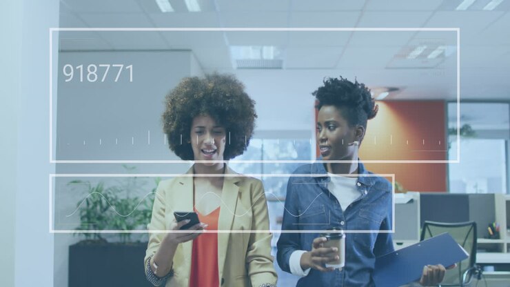 Animation of graph, changing numbers, diverse female coworkers discussing while walking in office