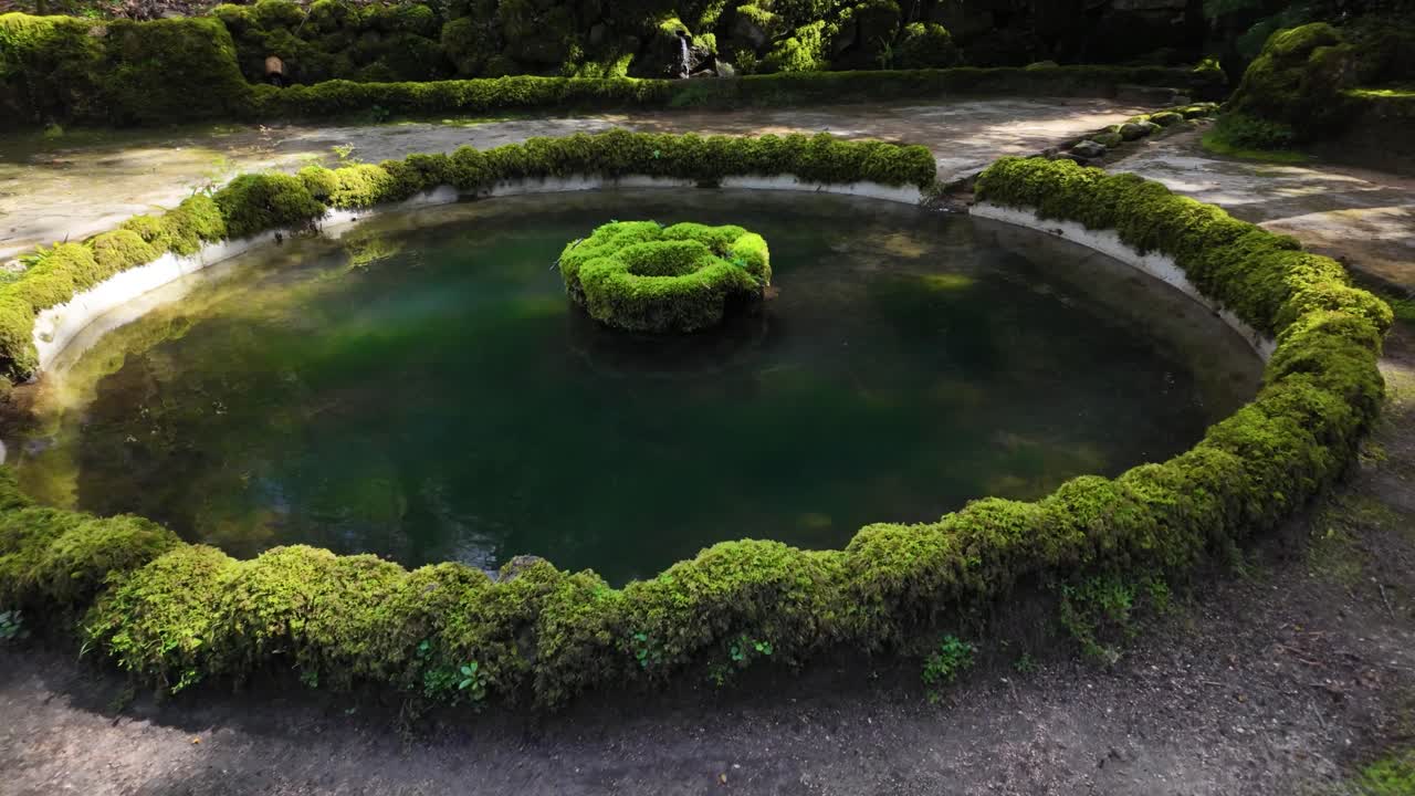 Slowmotion view of circular pond near Pena Palace, Sintra