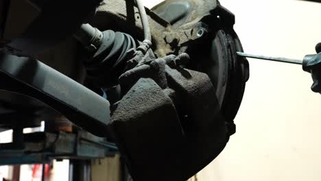 technician working, vehicle braking system faults, motor industry repairs