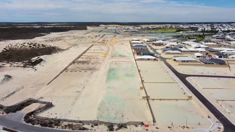 reverse aerial view over beach lookout to reveal amberton beach and indian ocean - perth