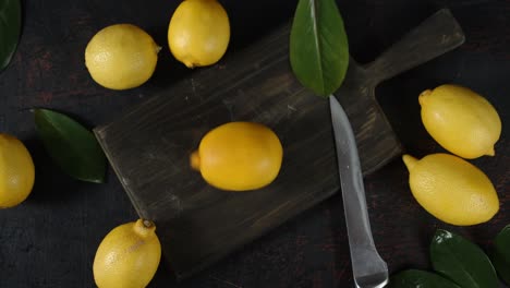 lemon spinning on a wooden cutting board.