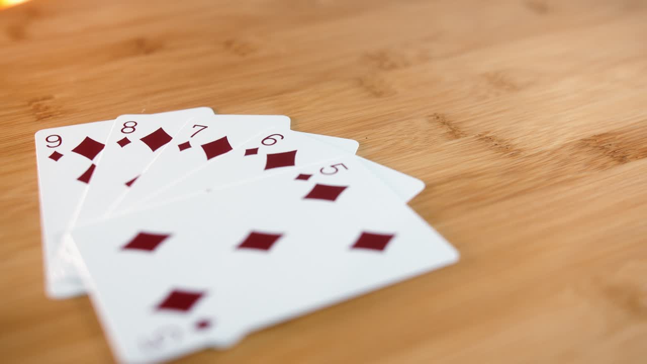 Close Interior Static Shot of Straight Flush of Cards on Spinner