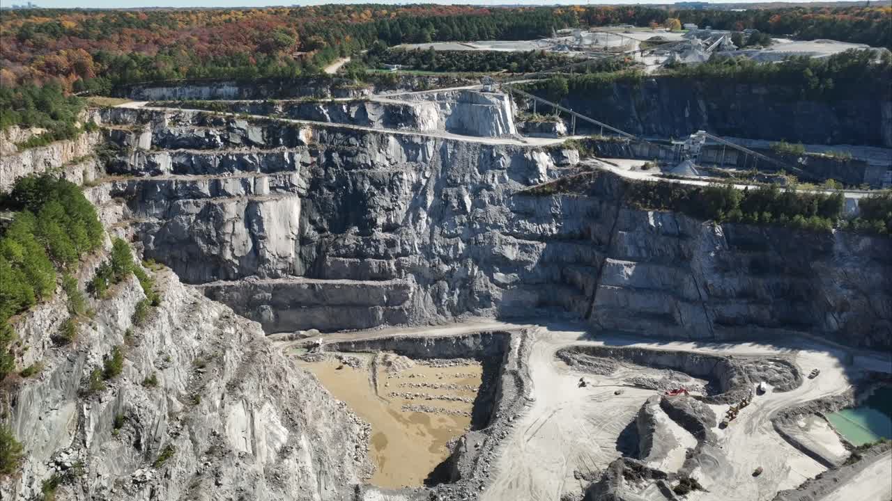Rock Quarry aerial view pullback