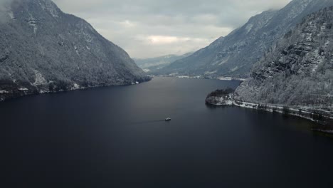 Footage-filmed-with-a-drone-over-a-lake-by-a-town-called-Hallstatt-in-Austria-in-Europe