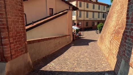 exploring cobblestone paths in cuneo, italy