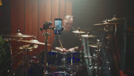 drummer recording a drum tutorial video